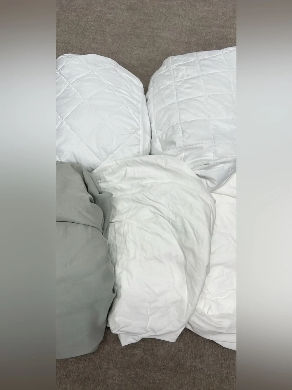 Assorted twin sheets and mattress protectors